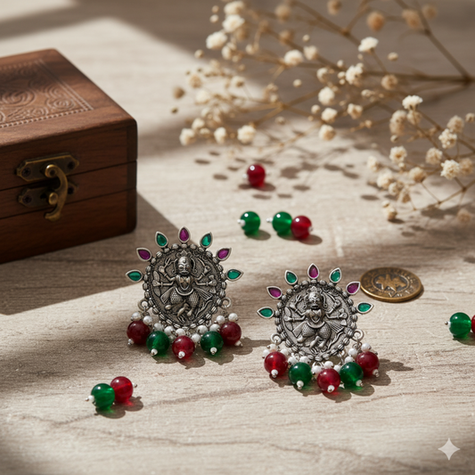 Floral & Circular Oxidized Silver-Plated Drop Earrings with Maroon Stone Embellishments.